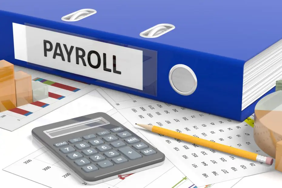 Blue binder and payroll equipment for Payroll Services with Jennifer Young's Bookkeeping in Rapid City, S.D.